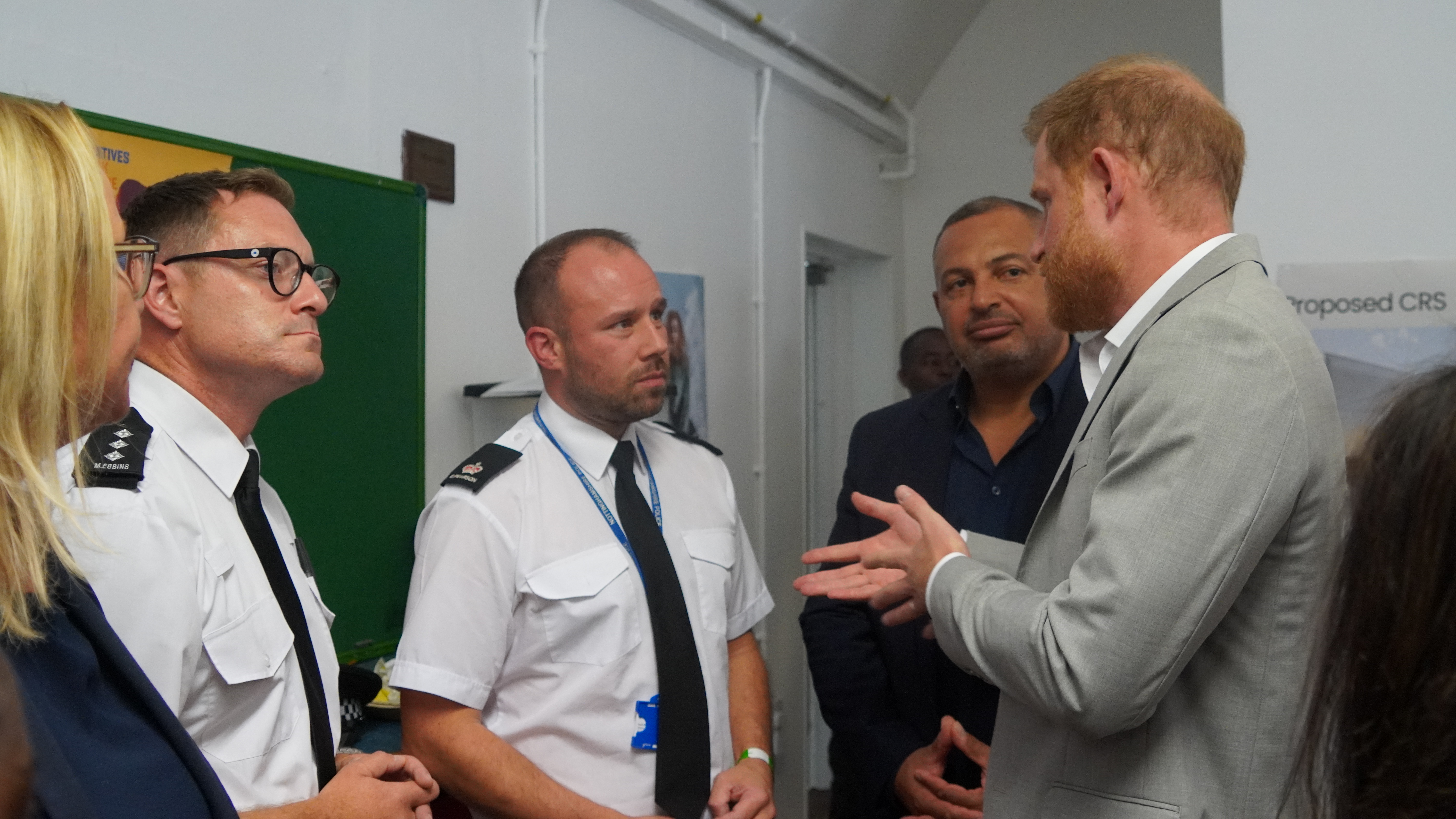People speaking with Prince Harry