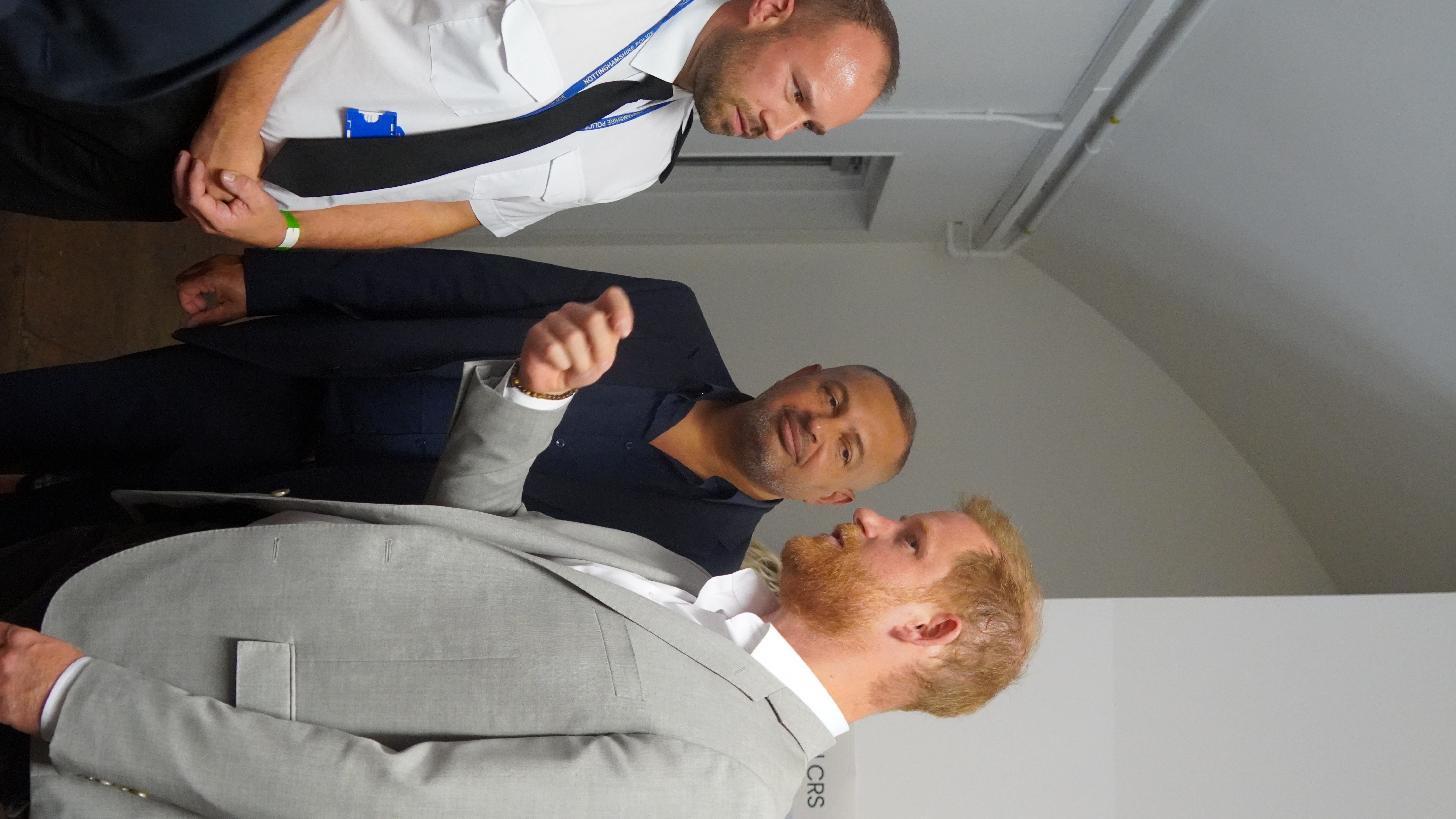 Prince Harry speaking with Superintendent Pearson