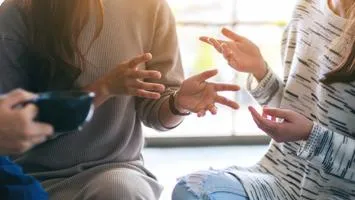 Generic image of women in conversation.