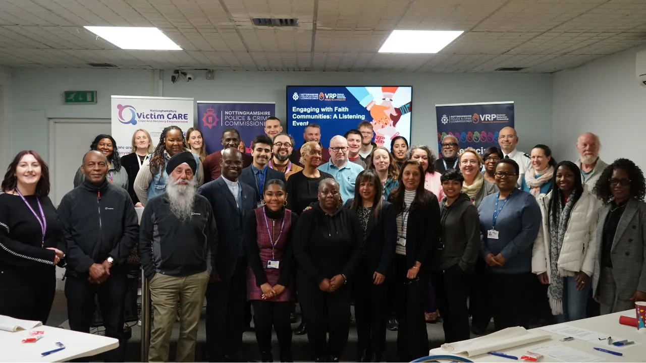 A group shot of attendees at the faith listening event