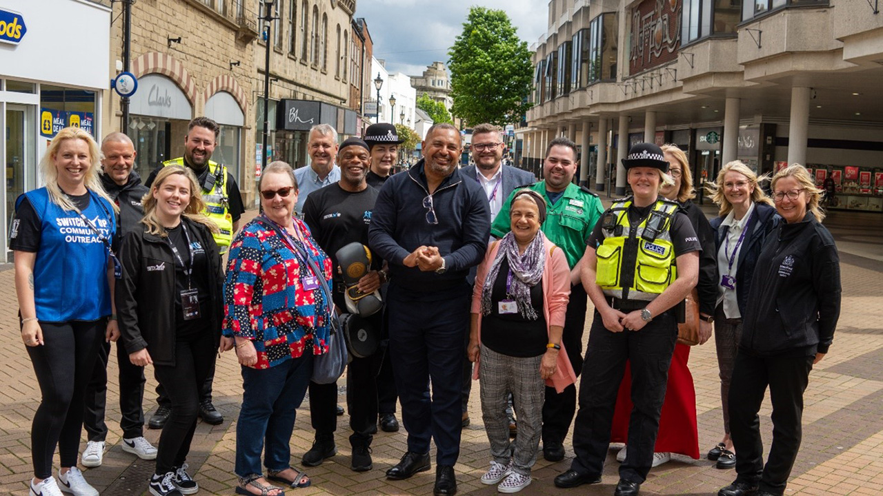 Gary Godden pictured with locals from Mansfield