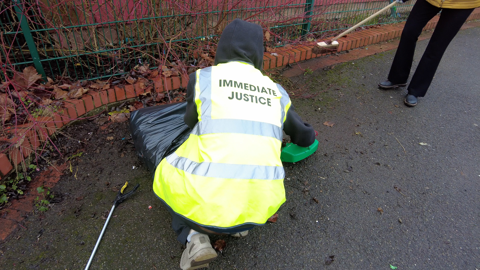 An Immediate Justice service user picking up litter at a Day of Action