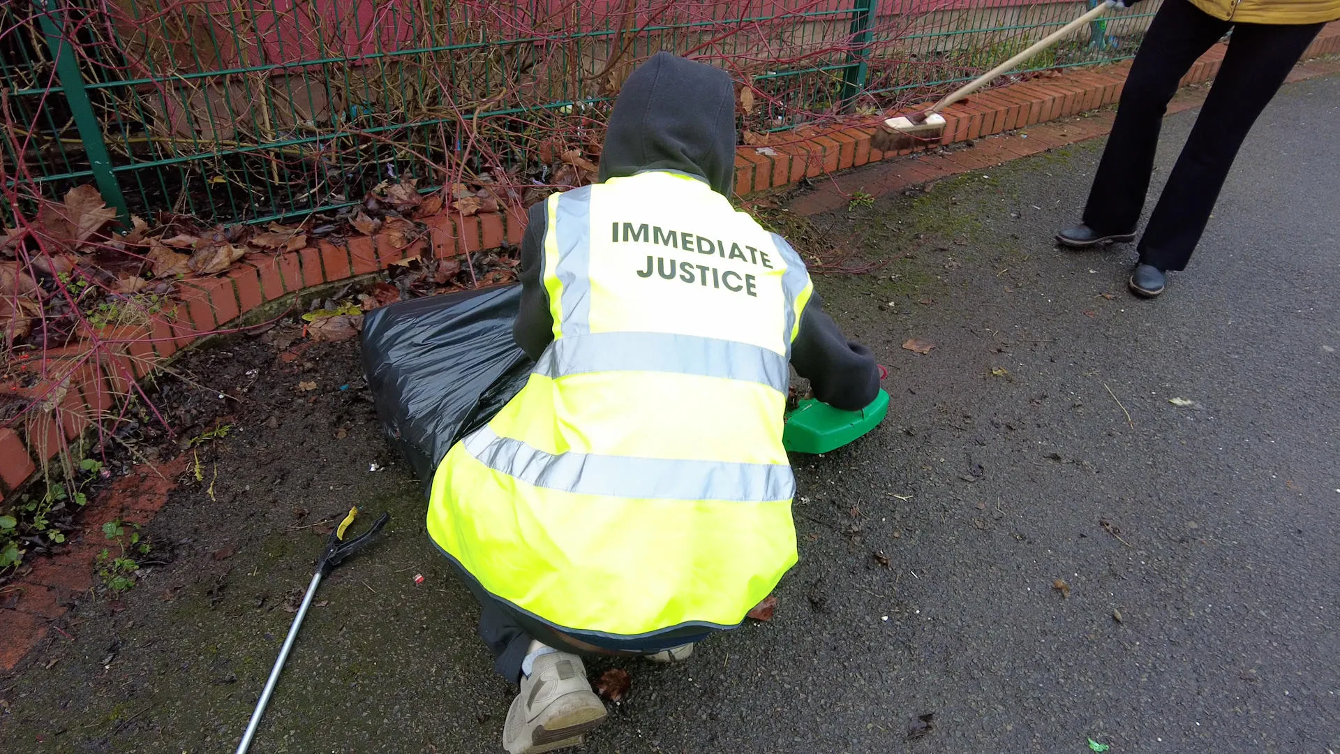 An Immediate Justice service user picking up litter at a Day of Action