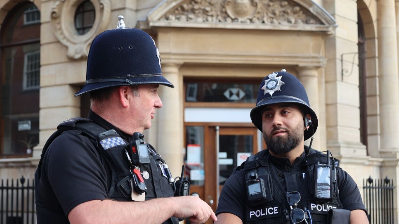 Two officers standing outside talking