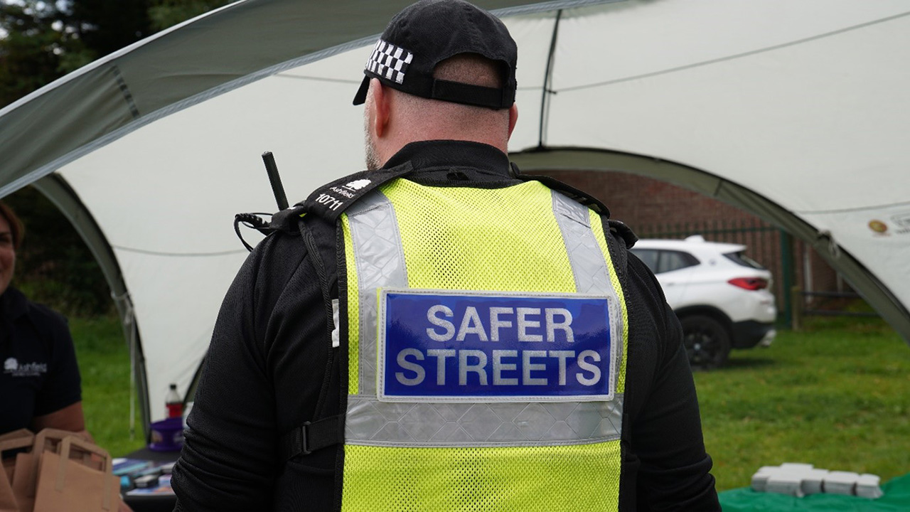 Officer wearing Safer Streets uniform