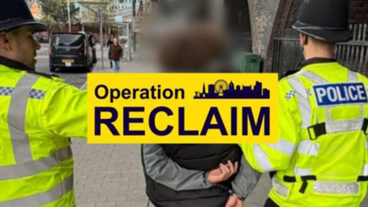 Two officers making an arrest with an Operation Reclaim banner