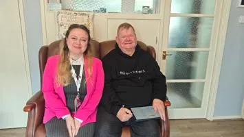Colin Thompson alongside a member of staff from Nottinghamshire Victim CARE