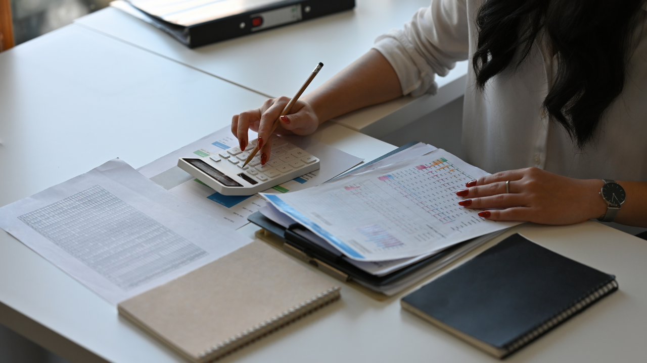 someone completing accounts documents 