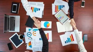 Shaking hands across a table