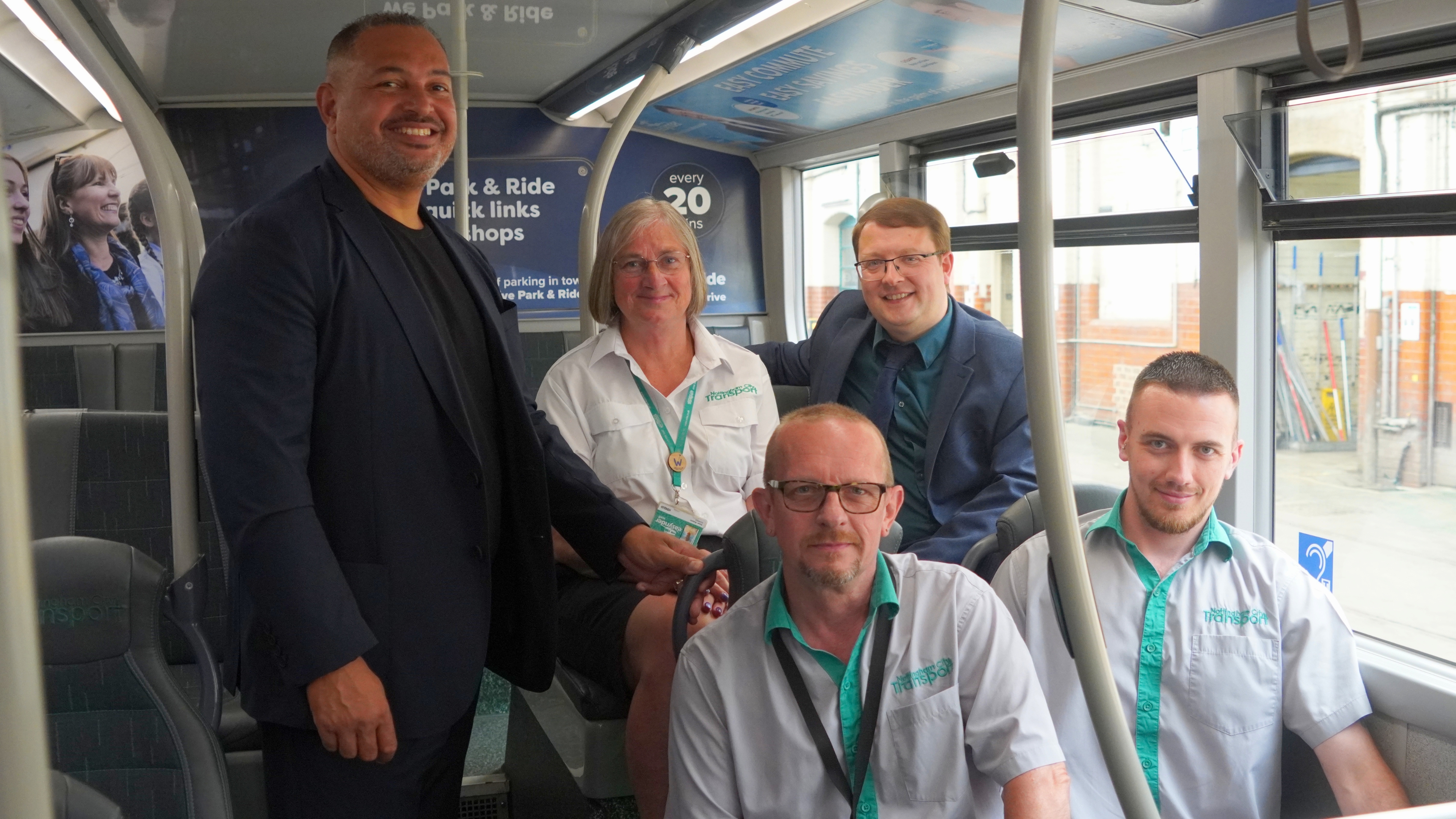 PCC Godden alongside drivers and staff from Nottingham City Transport sitting on a bus
