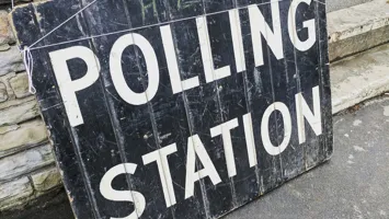 A picture of a polling station sign.