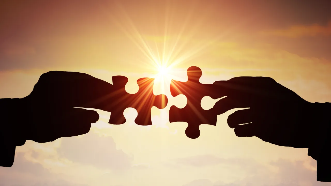 Image of a jigsaw being put together