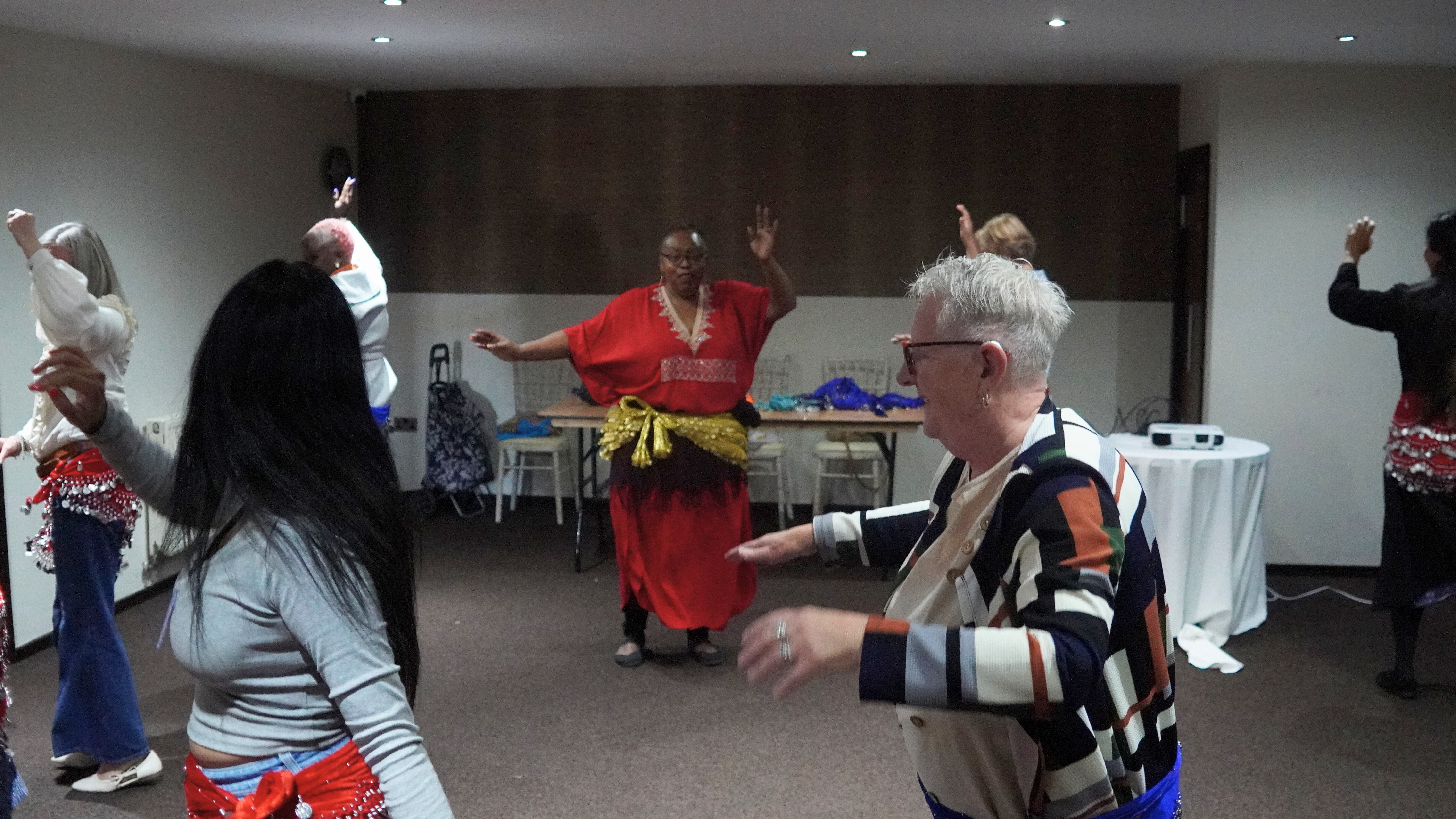 Attendees taking part in Belly Dancing
